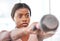Fitness, kettlebell and black woman doing an exercise with a weight with strength, focus and motivation. Sports