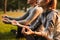 Fitness loving couple friends in park make meditate exercises.