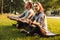 Fitness loving couple friends in park make meditate exercises.