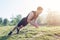 Fitness man doing clapping push-ups exercise intense training outdoors.