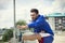 Fitness man doing stretches outdoors