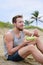 Fitness man eating healthy salad meal at workout