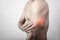 Fitness man touching his inflamed triceps zone, body pain concept
