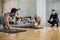 Fitness man and woman buddies do fist bump in gym after the workout.