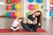 Fitness mother and child. Sports activities with children. Fitness center. Mom and baby gymnastics, yoga exercises. Health and