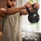 Fitness, muscle and man with kettle bell in gym for exercise, bodybuilder training and workout. Sports, motivation and