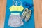 Fitness outfit on exercise mat with weights and running shoes. Sports bra and grey shorts for training at home . Style and fashion