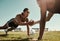 Fitness partner, exercise and sport training with couple workout in a park doing pushup for wellness in nature