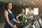 Fitness people training in gym on treadmills