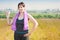 Fitness plus size woman with towel and water bottle