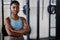 Fitness, portrait or black woman at gym with arms crossed ready for a workout, exercise or training for health. Face of