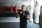 Fitness, punching and portrait of man in gym for exercise, boxing challenge or competition training. Power, muscle and