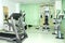 Fitness room with various body shaping machines, empty without customers