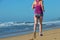 Fitness and running on beach, woman runner working out on sand near sea, healthy lifestyle and sport