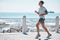 Fitness, running and man by ocean for exercise, marathon training and endurance workout in action. Sports mockup