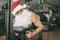 Fitness Santa Claus training femoral muscle in fitness gym ready