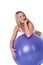Fitness series - Smiling woman with purple ball