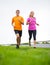 Fitness sport couple running jogging outside