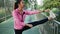 Fitness sport girl fashion sportswear doing yoga fitness exercise in street. Fit young asian woman doing training workout.
