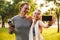 Fitness sport loving couple holding bottle with water.