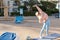 fitness, sport, people and healthy lifestyle concept - woman making yoga in lord of the dance pose on mat over beach and