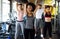 Fitness, sport, people and lifestyle concept. Group of smiling people exercising together in gym