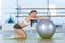 Fitness, sport, training and people concept - woman with fitness ball