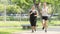 Fitness sport two slim fit and fat girls in fashion sportswear running in garden morning, outdoor sports