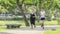 Fitness sport two slim fit and fat girls in fashion sportswear running in garden morning, outdoor sports