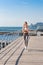 Fitness sport woman running on beach outside