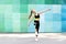 Fitness sport young girl in sportswear doing yoga fitness exercise on a wall background. Sporty gymnast child preteen training