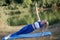 Fitness sports girl on the river bank