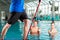 Fitness - sports gymnastics under water in swimming pool