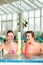 Fitness - sports gymnastics under water in swimming pool