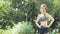 Fitness sporty girl in fashion sportswear standing and smile in garden park, outdoor sports