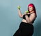 Fitness spring diet weight loss concept. Self-confident plus-size overweight woman does exercises with weights dumbbells