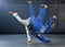 Fitness, strength and men in a karate fight in a gym for martial arts exercise. Action, motion and learning to take down