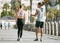 Fitness, teamwork or health with a runner couple on the promenade for cardio or endurance from the back. Exercise