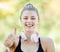 Fitness, thumbs up and portrait of woman with smile in park for wellness, healthy lifestyle and cardio. Sports