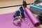 Fitness tools dumbbells yoga mat and shoes on a wooden floor. Healthy living concept