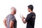 A fitness trainer explains to an elderly man client how to use a software application for training On a white isolated