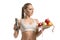 Fitness trainer holding a plate with fruit view