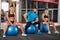 Fitness trainer and two girls posing