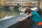 Fitness woman catching breathe in front of ponte vecchio in flor