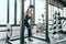 Fitness woman deadlift barbell in Smith machine