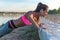 Fitness woman doing push ups Outdoor training workout summer evening. Concept sport healthy lifestyle.