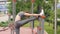Fitness woman doing stretching exercises to legs on outdoor training
