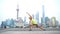 Fitness woman doing yoga in Shanghai city