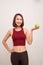 Fitness woman eating apple.