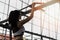 Fitness woman exercising on chin-up bar.